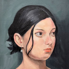 photo of young woman with black hair painting